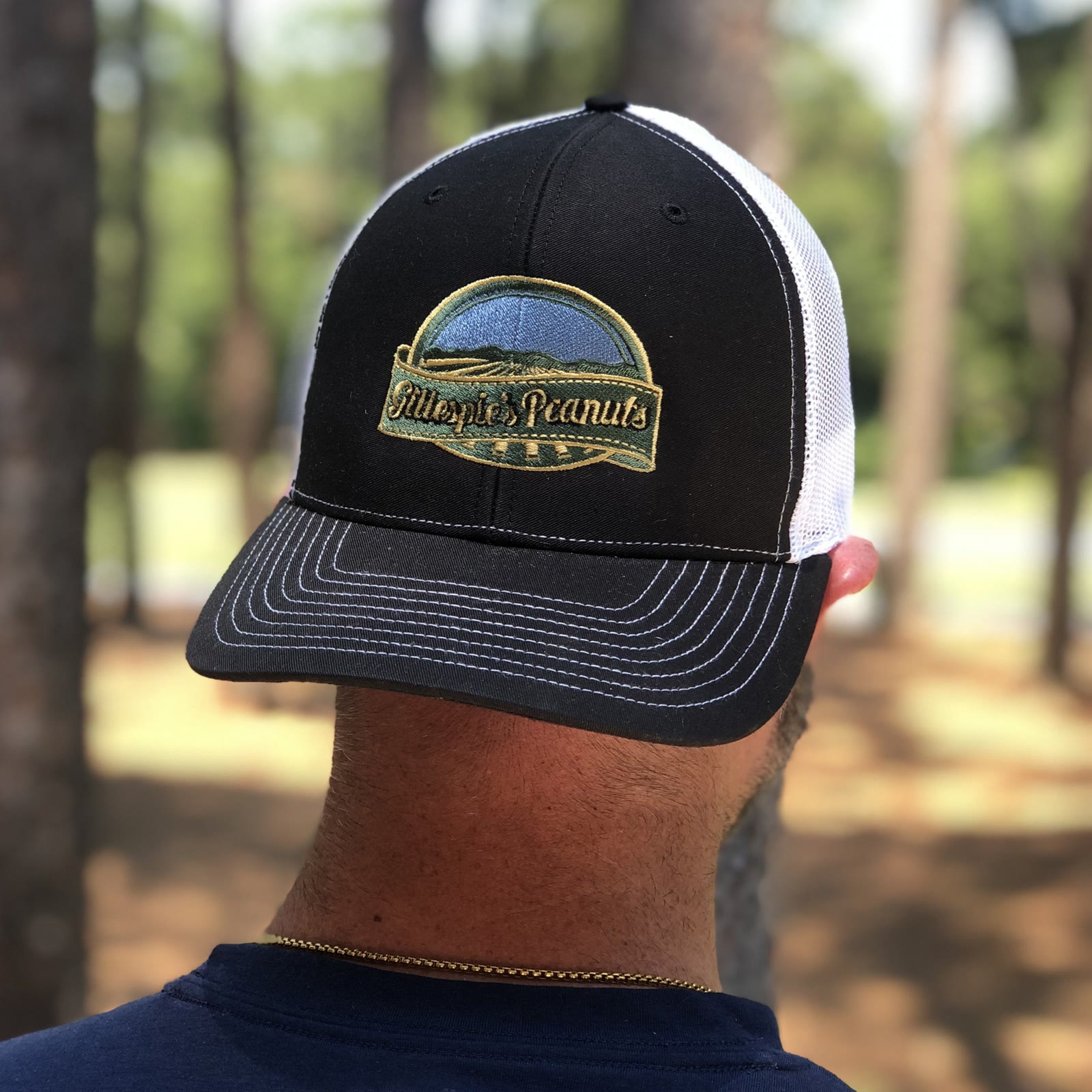 A black Gillespie's Peanuts trucker hat